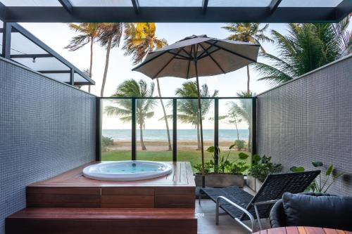 Jardim Oceania Apartamento | Loft com hidromassagem frente mar e pé na areia