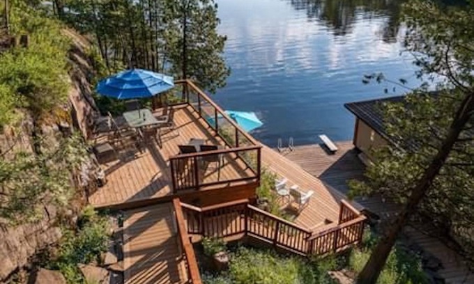Windermere Cabaña | Log home & guest cottage in old forest, Waterfall, Sunsets, Sauna, Fishing Boat