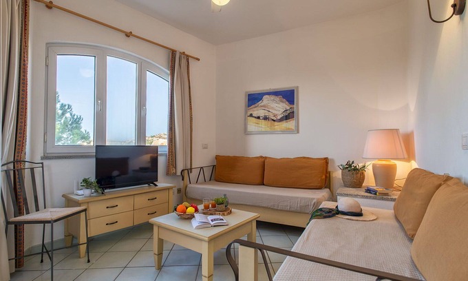 Canneddi Apartamento | Hermoso apartamento para 4 personas con piscina, WIFI, A/C, TV, terraza y mascotas permitida