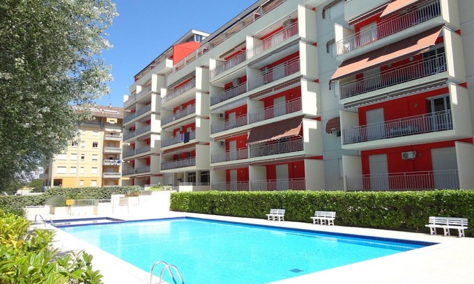 Porto Santa Margherita Apartamento | Precioso piso con balcón y piscina compartida.
