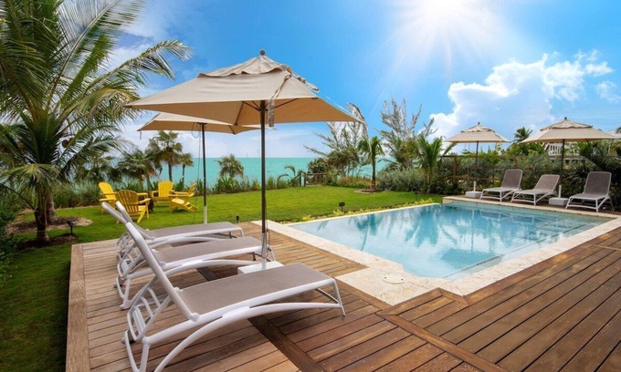 North Palmetto Point Casa | Nueva casa frente al mar con piscina privada, privilegios de resort y amenidades