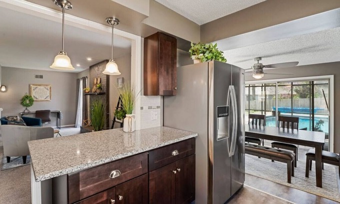South Kansas City Casa | Luxurious Poolside Escape on 106th Street: Your Private Oasis in Kansas City
