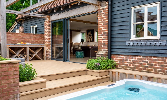 Funtington Cabaña | Luxury Cottage near West Wittering with hot tub and outdoor fireplace.