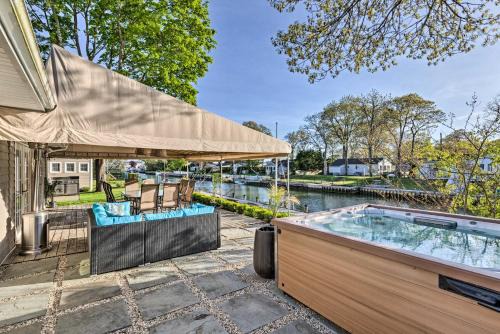 East Quogue Casa | Luxury Hamptons Home on Canal with Dock and Kayaks!