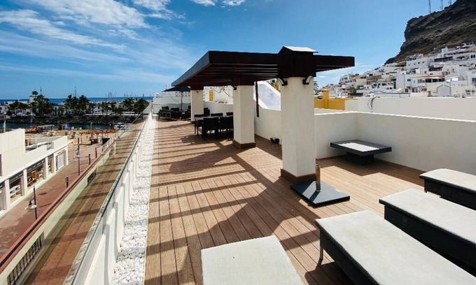 Playa de Mogan Apartamento | Luxury penthouse in town center Puerto Mogan with ocean and beach views.