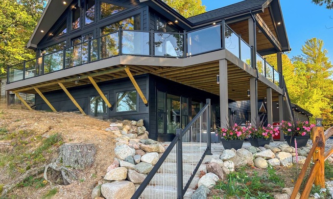 Kalkaska Casa | Luxury Scenic Lakeside Haven: Kayaks, Fire Pit, Multi-Deck, Game Room, Dock