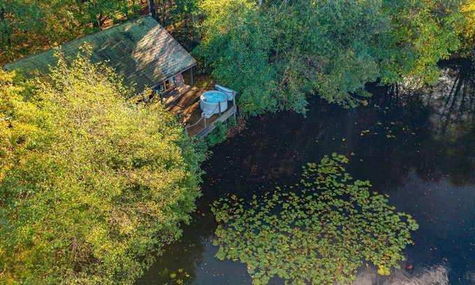 Earls Colne Cabina | Luxury secluded lakeside cabin with hot tub. Pet Friendly!