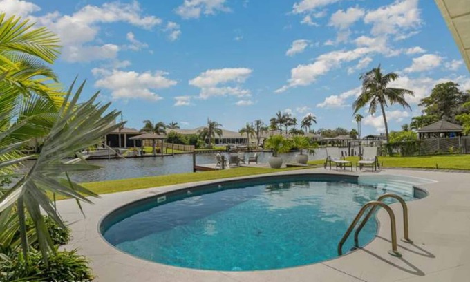 Cocoa Beach Casa | Luxury Waterfront -Heated Pool, Dock, Bikes & Paddleboards - Mins to Beach