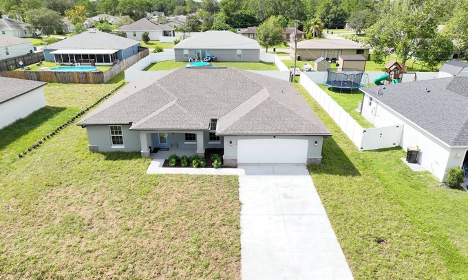 Port Malabar Casa | "Modern 4BR, 2BA home: brand new, spacious & family-friendly in prime location!"