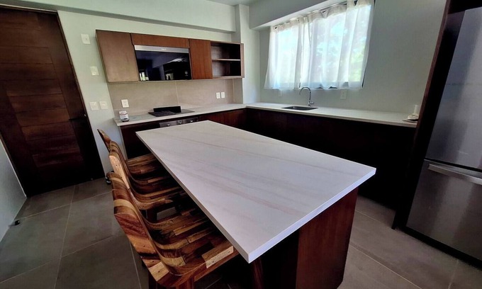 Playa Chahué Apartamento | Modern Apt with Pool - 5 Min walk to Chahue Beach