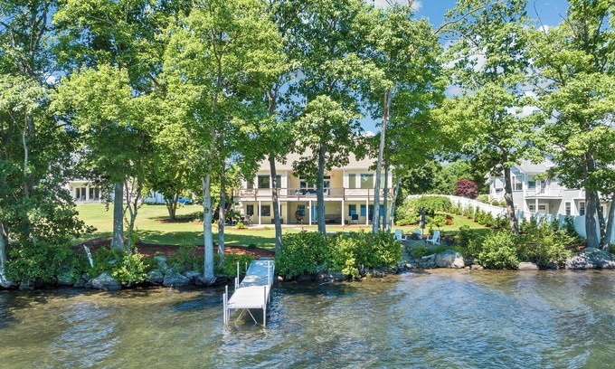Laconia Casa | Modern Lake Opechee Home features Sandy Perched Beach and Dock