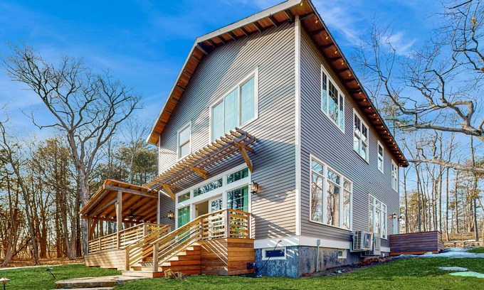 Charlotte Casa | Modern lakehouse w/ private beach, dock, fireplace, gym, theater, jacuzzi tub