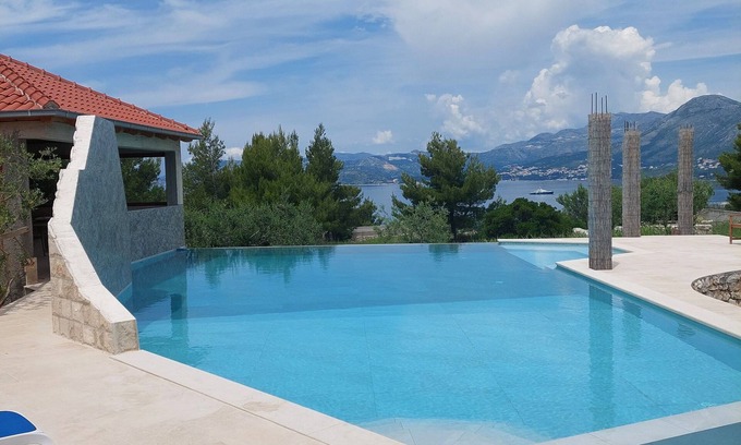 Cavtat Villa | Modern stone villa with infinity pool.