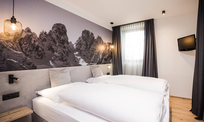 Villabassa Apartamento | Montanaris Alpine~Active~RelaxThe base camp with pool and saunas in the Dolomites.