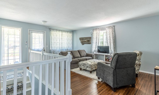 Woods Bay Casa | Mountain-view home with large deck, gas grill, firepit, lawn, and central AC