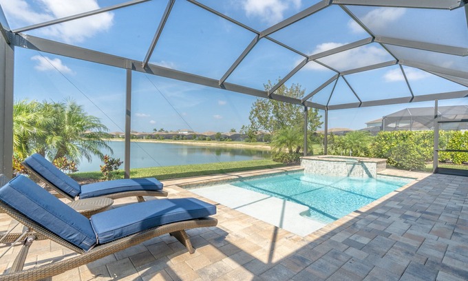 Naples Casa | 🌴 Naples Reserve Lakeview Escape | Lanai w/ Pool & Hot Tub, Outdoor Kitchen, EV & Pet Friendly
