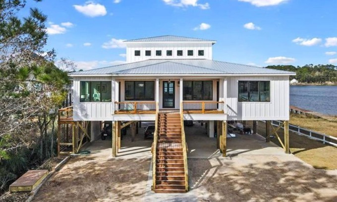Gulf Shores Casa | New, bayfront custom home with pier for your boat plus outside deck