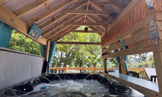 Brevard Cabaña | Tiki bar cottage with largest porch in NC and hot tub, views and fire pit!