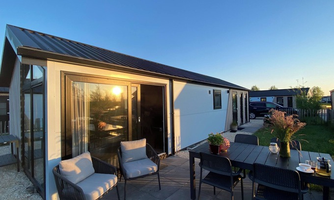 Municipality of Kampen Casa | NEW Elegant waterfront chalet with jetty Lake Kampen Netherlands vacation home boat