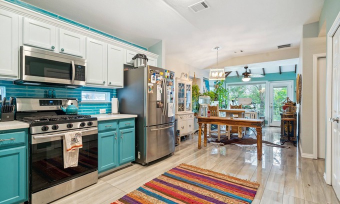 Kyle Casa | NEW LISTING! Eclectic Oasis: Artful & Colorful Comfort by RedAwning