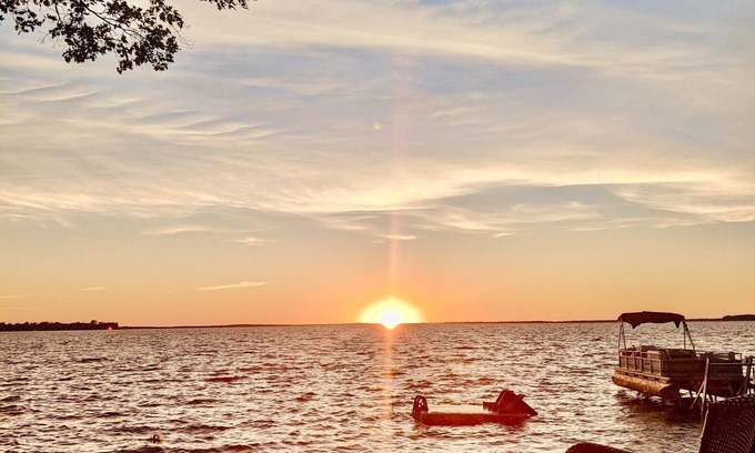 Prudenville Casa | New Listing! Lake front cottage with 100' of private sandy beach
