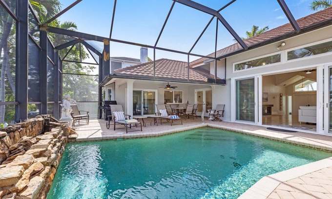 Marco Island Villa | Newly Updated Villa Heated Pool Canal Front Walk to Beach 3 min drive