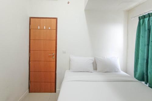 Panakkukang Apartamento | Nice and Homey 2BR at Vida View Makasar Apartment By Travelio