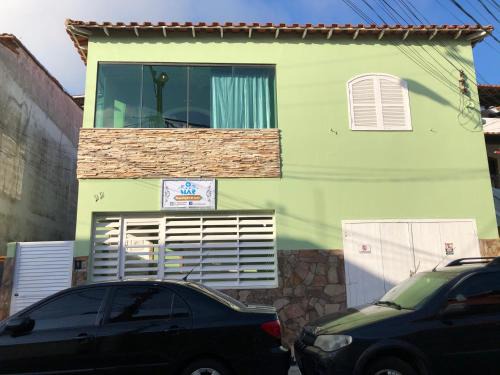 Taio Casa | O Mar Hospedagem - SUÍTES PRIVADAS