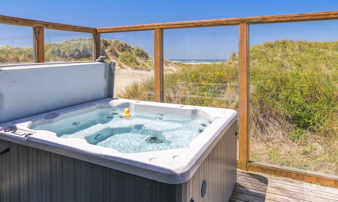 Bayshore Casa | Alquiler de vacaciones frente al mar. ¡Salga directamente de la puerta sobre la arena! ¡Bañera de hidromasaje! ¡NOCHE LIBRE!