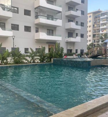 Ain Harrouda Apartamento | Ocean park , for married couples and families only , Luxury fully furnished one bedroom flat next to zenata beach with five avialable swimming pool at the compound