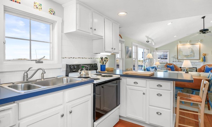 Sagamore Beach Casa | Oceanfront at Sagamore Beach with clean, crisp, Cape Cod interior and coastal furnishings