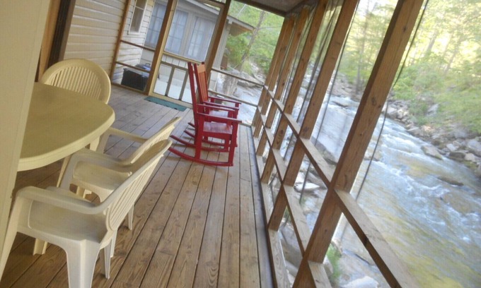 Bat Cave Cabaña | On the River's Edge!! Rocking chairs on large screened porch on river's edge.