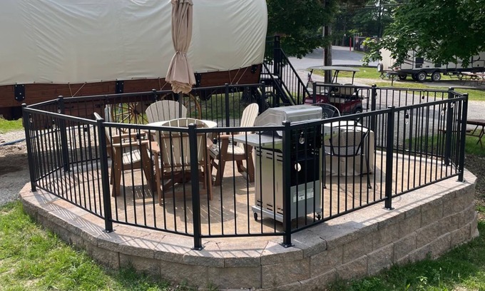 Branson Cabaña | Oregon Trail Wagon has two queens size bed, bathroom w/ shower, heat & a/c, smart tv, wi-fi, microwa