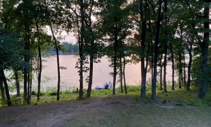 Delton Casa | Peaceful Lake House with pontoon boat rental on property.