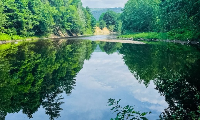 Newfane Casa | Peaceful riverfront house, dog-friendly, woodstove, decks, bbq, firepit, dock