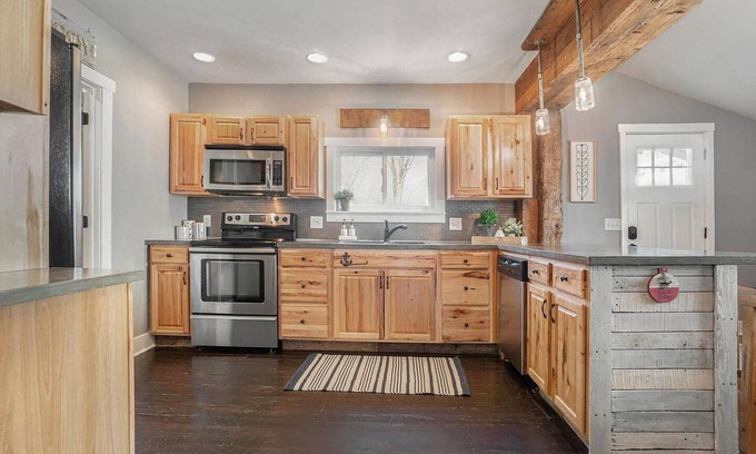Macatawa Casa | Perfect Gathering Spot with a Fire Pit, Adirondack Chairs, Hammocks & Kayaks, Near Lake and Beaches