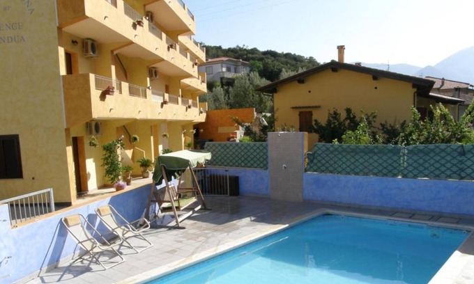 Fluminimaggiore Casa | Apartamento "Residence Pianeta Sardegna 2" con piscina, aire acondicionado y jardín