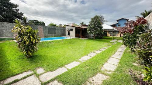 Manguinhos Casa | Piscina, Garagem, Praia e Conforto em Manguinhos