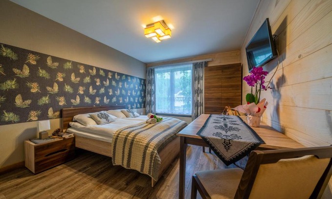 Zakopane Casa | Pokoje z widokiem na góry i Prywatny Domek z zadaszoną altaną - grillem i ogniskiem.