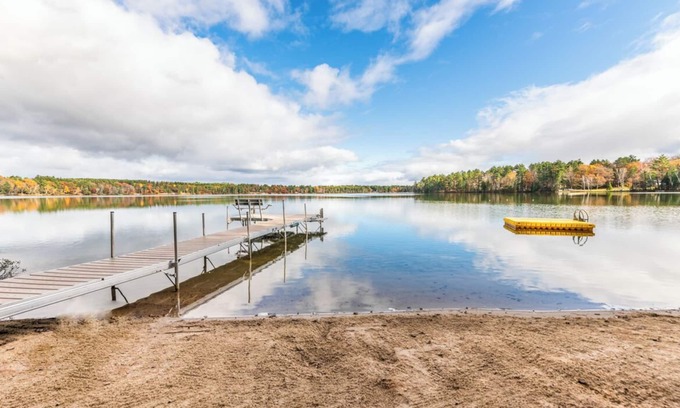 Eagle River Casa | Porch in the Pines | Lakefront home w/ AC! Sandy Beach, Dock, Dogs OK