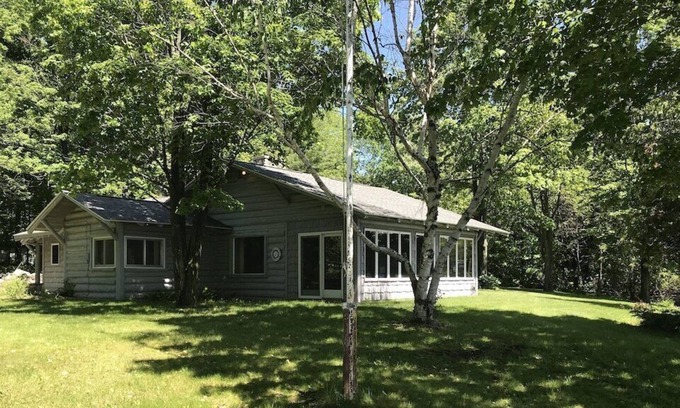 East Jordan Cabaña | Porter Estates Big Cabin is a private lake front cottage.