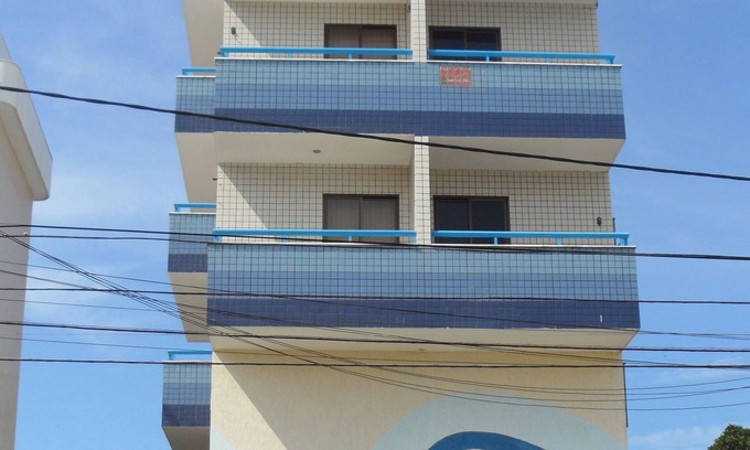 Vila Nova Apartamento | LO MEJOR * A dos cuadras de Praia Forte w / AR, WiFi, Smart TV, Sky, hamaca, garaje