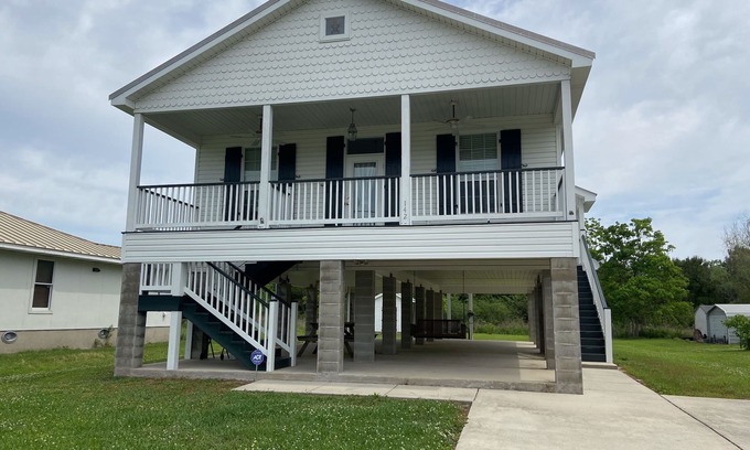 Waveland Casa | Pretty raised three bedroom beach home awaits you! A short 3 min. walk to beach!
