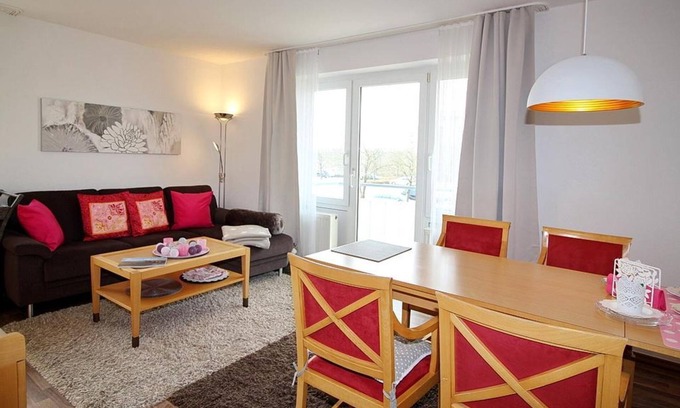 Schillig Apartamento | Pretty vacation apartment by the sea with balcony and view of the green North Sea dike - Hus