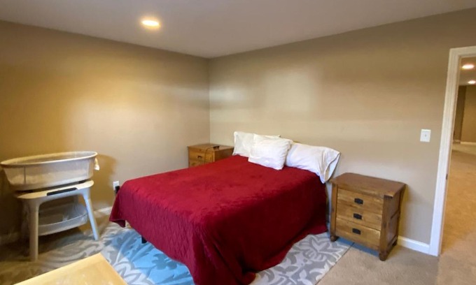 Maxwell Casa | Private basement bedroom with private bathroom, kitchen, and living room with large screen television