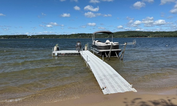 East Jordan Casa | Private DOCK & Beach on Lake Charlevoix / Pontoon Rental / GolfCart / RV Parking