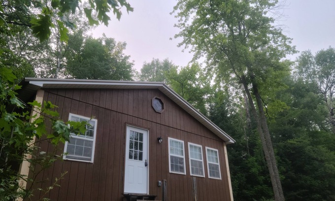 Curtis Township Casa | Private lake! Paddle boat and rowboat. Perfect for hunting/fishing