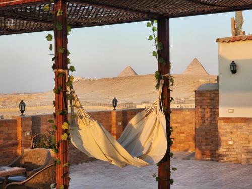 Pyramids Gardens Apartamento | Private rooftop with jacuzzi and pyramids view