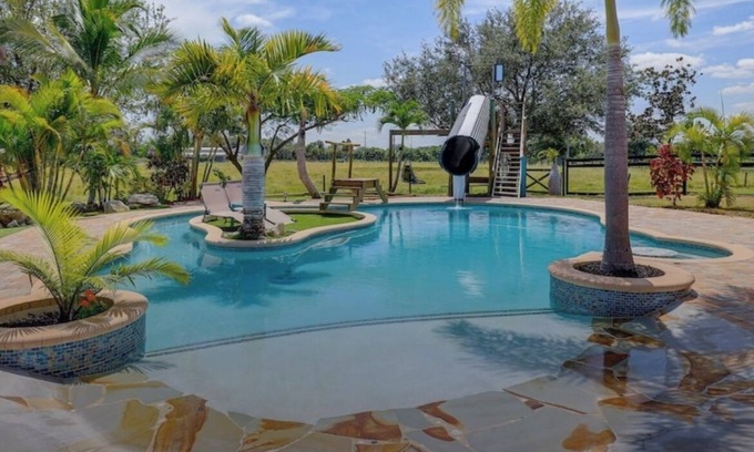 White City Casa | Private Tropical Oasis 4/2 Home with Resort Style Pool & Waterslide
