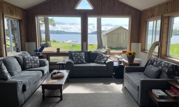 Kalkaska Cabaña | Quaint Family lake cottage w/beach, dock,internet on all sports Crawford Lake